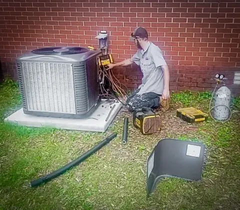 An SS&L technician diagnoses the issue with a customer's AC and begins to repair it.